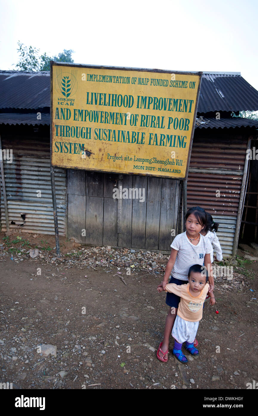 Naga Village Children Beneath A Government Sign For Livelihood ...