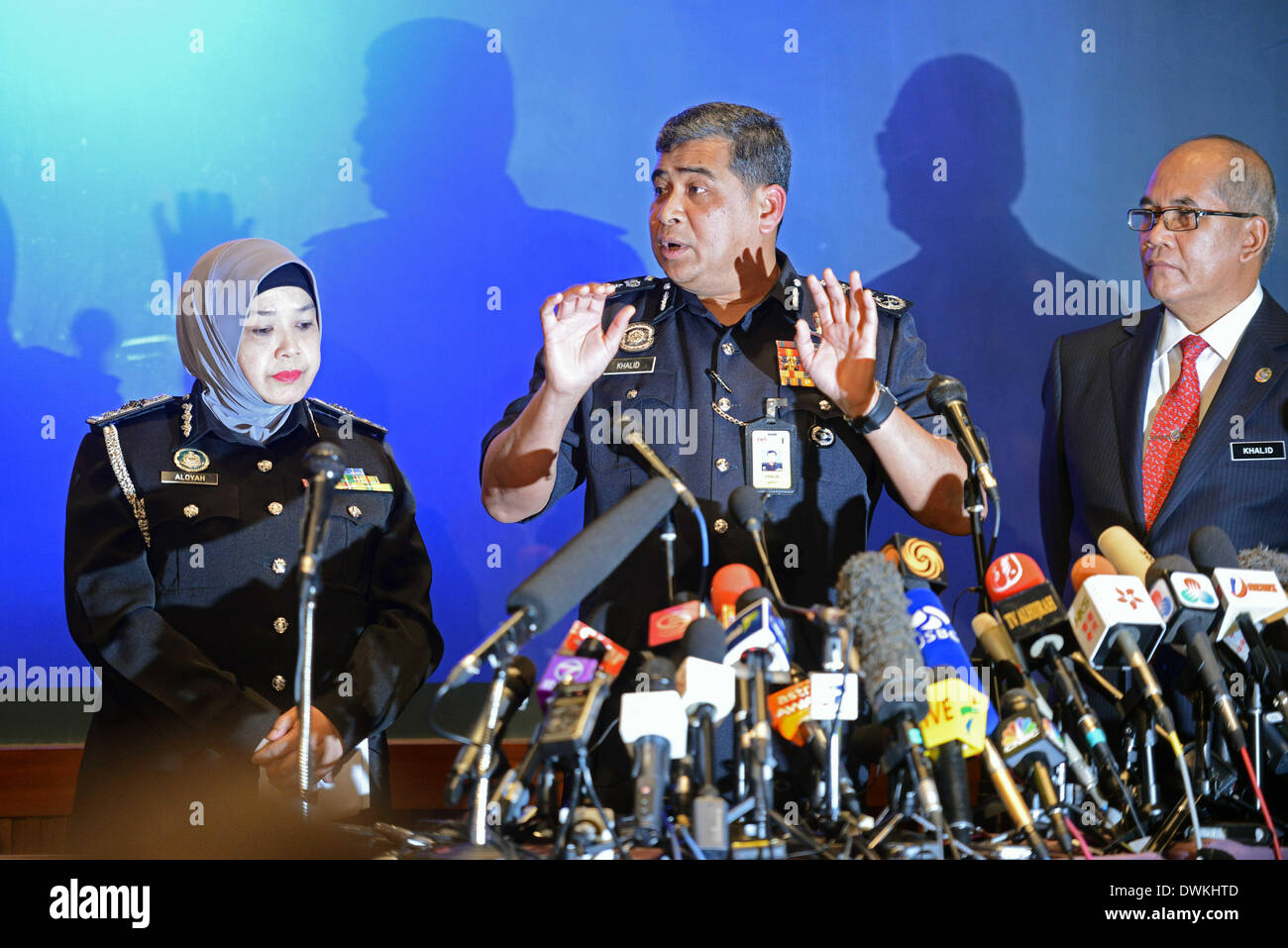 March 11, 2013 - Kuala Lumpur, Malaysia - Tan Sri Khalid Abu Bakar (center) the newly elected Inspector General of Police (IGP) answer questions during the press confrence on the fourth day of the missing Malaysia Airlines plane, MH370 in Sepang, outside Kuala Lumpur, Malaysia, Saturday, March 11, 2014. The search operation for the missing Malaysia Airlines MH370 which has involved 34 aircraft and 40 ships from several countries covering a 50-nautical mile radius from the point the plane vanished from radar screens between Malaysia and Vietnam continues after its disappearance since Saturday.  Stock Photo