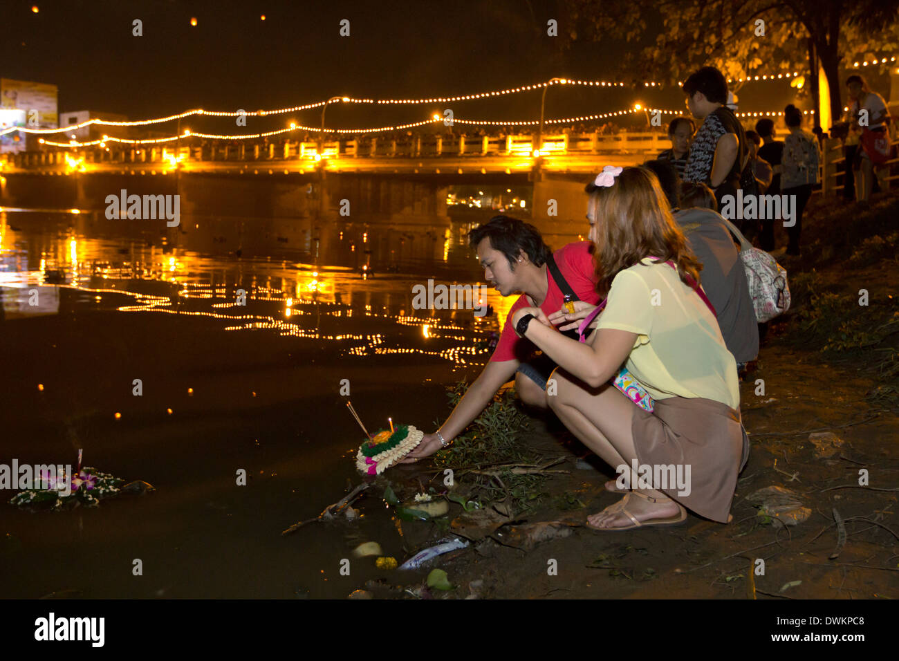 Releasing offerings into river at Loi Krathong festival, Chiang Mai, Northern Thailand, Thailand, Southeast Asia, Asia Stock Photo