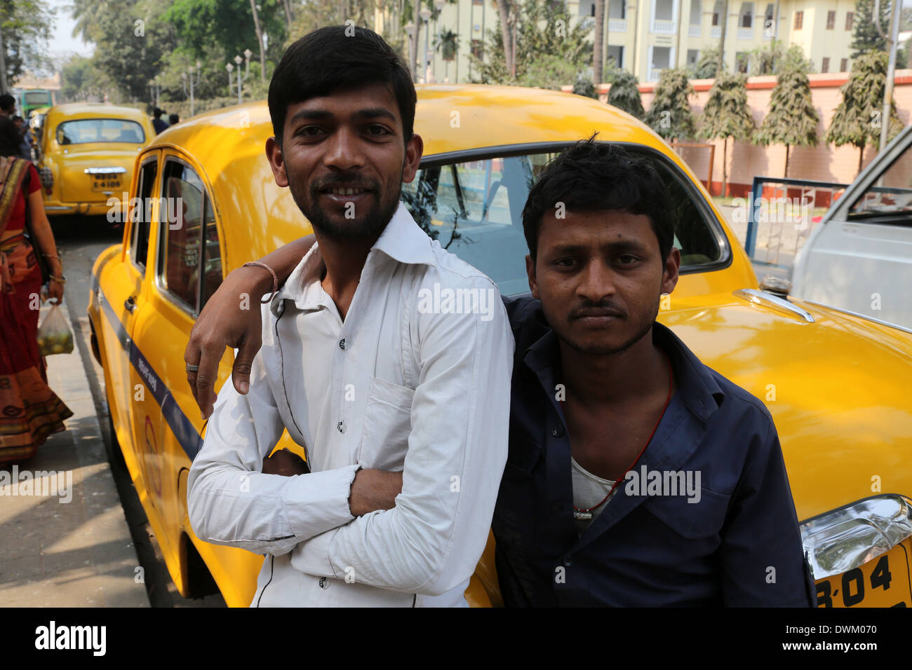 Indian taxi driver posing in front of his cab in Kolkata on February 14, 2014 Stock Photo