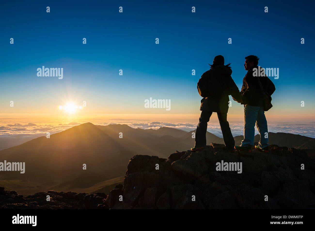 Tourists in backlight waiting for sunset. Haleakala National Park, Maui, Hawaii, United States of America, Pacific Stock Photo