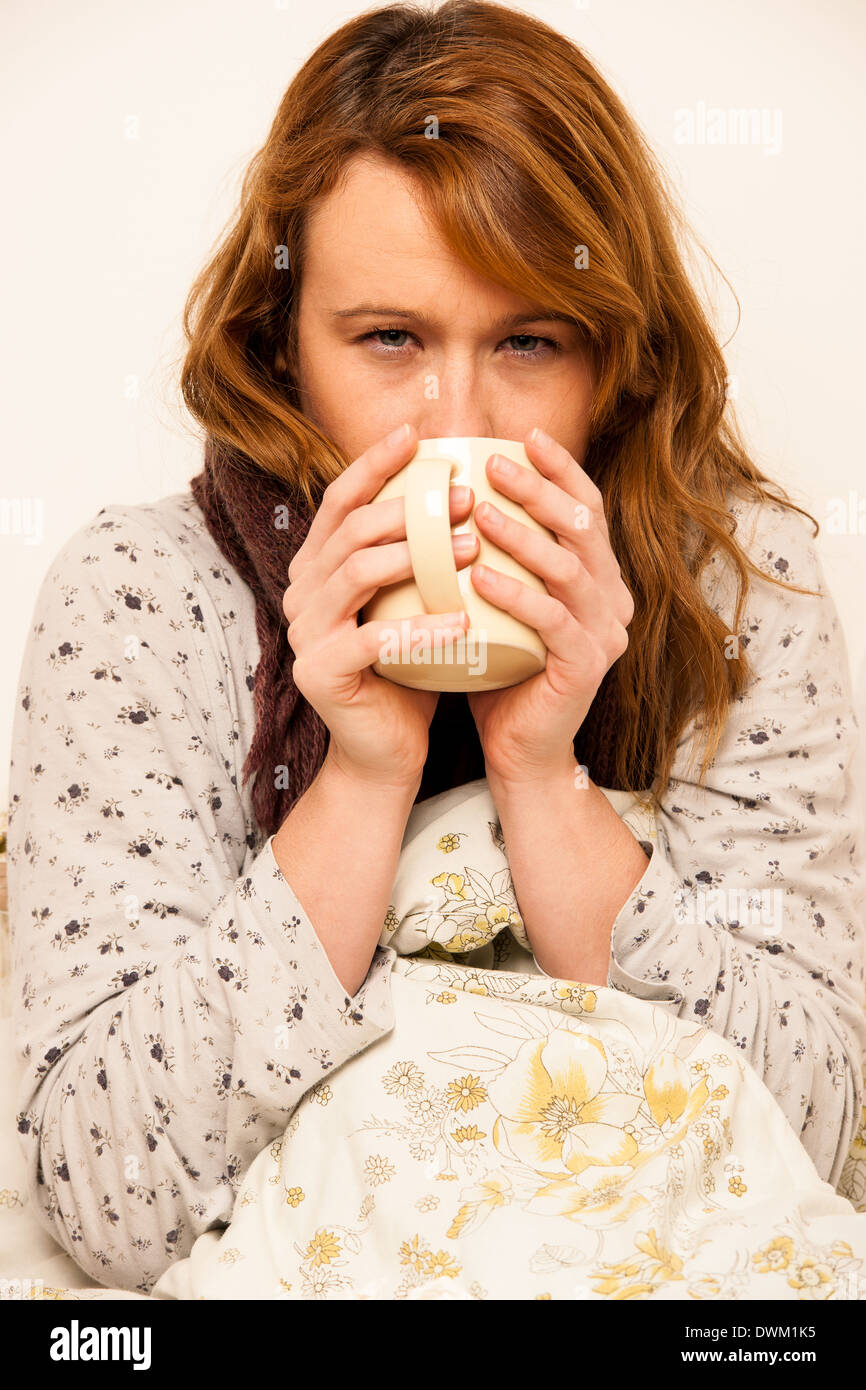 Woman under blanket hires stock photography and images Alamy