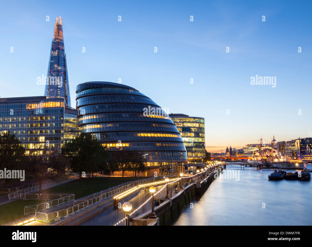 London skyline at dusk including the GLC building, HMS Belfast and the Shard, taken from Tower Bridge, London, England, UK Stock Photo