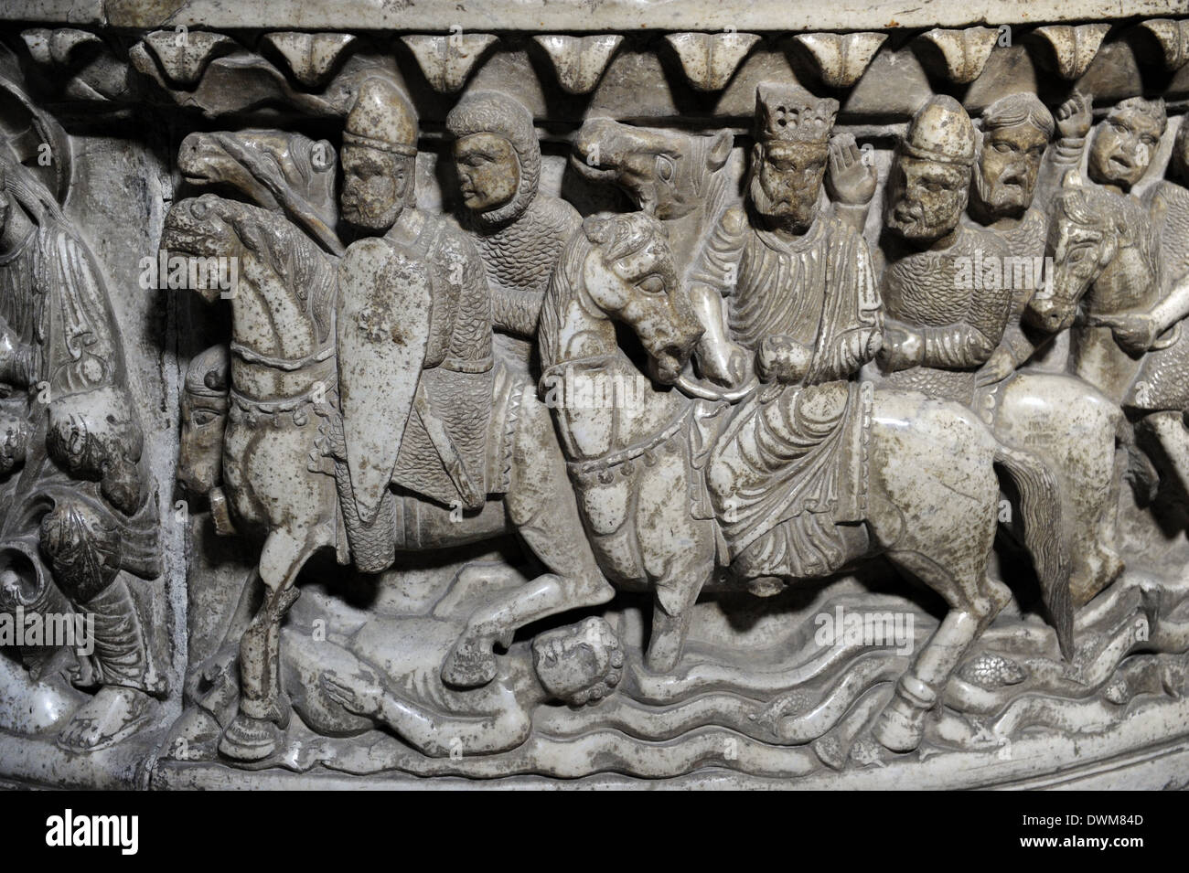 Italy. Lucca. Basilica of St. Frediano. Baptismal font. Romanesque. Life of Moses. Soldiers Crossing the Red Sea. Relief. Stock Photo