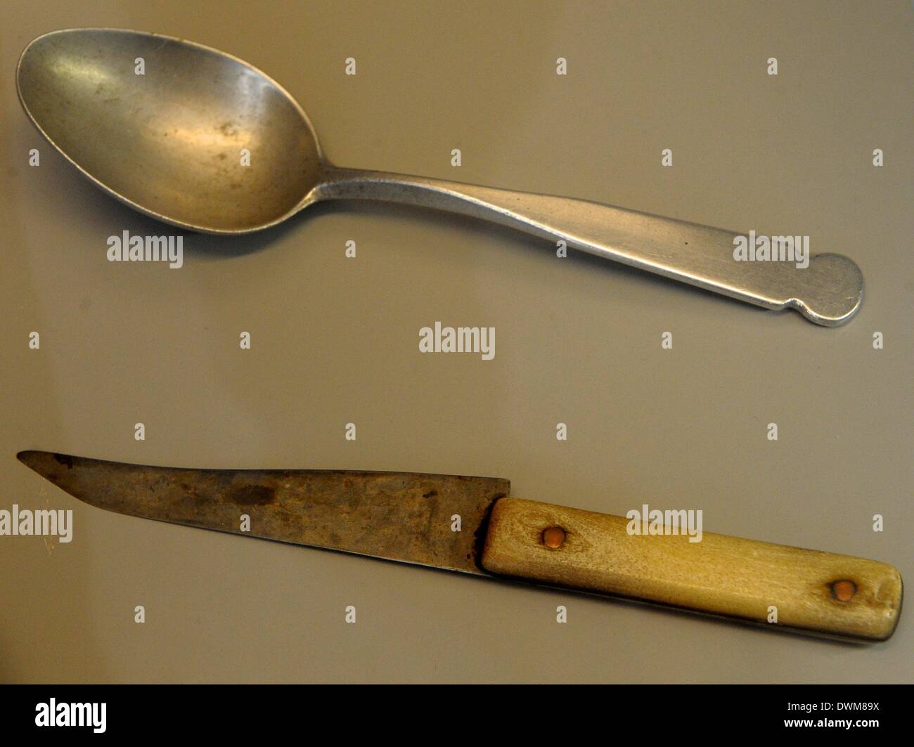 Leipzig, Germany. 11th Mar, 2014. An original self-made spoon (top) and a self-made knife with bony grip which were produced and used by Soviet prisoners are on display at the exhibition 'Gulag. Traces and evidences' at the Forum of Contemporary History Leipzig in Leipzig, Germany, 11 March 2014. The exhibition focuses on the history of the system of criminal and forced labor camps in the former Soviet Union and runs from 12 March until 29 June 2014. Photo: PETER ENDIG/dpa/Alamy Live News Stock Photo