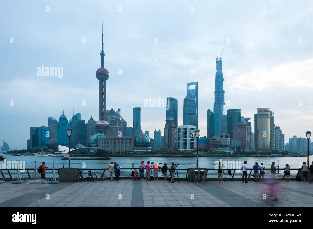Photographers take photos of the Shanghai skyline at dawn. Stock Photo