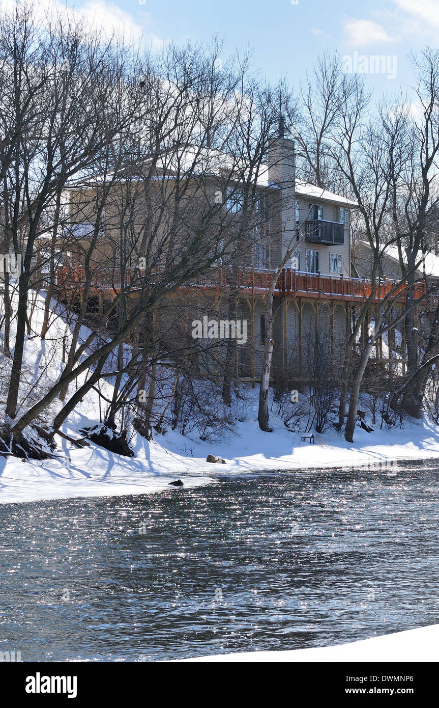 House along river prone to flooding. Stock Photo