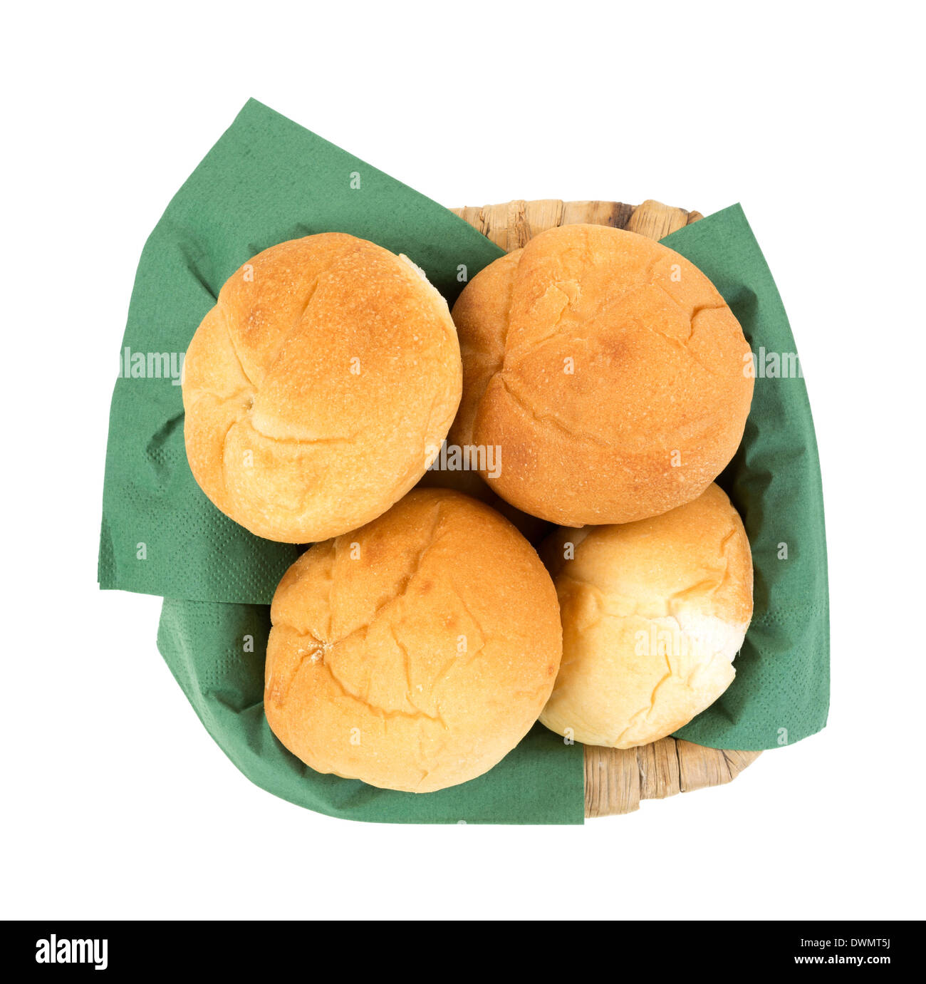 Top view of several freshly baked bulkie rolls in a basket that has been lined with green napkins. Stock Photo