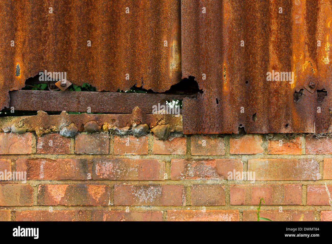 Rusty corrugated iron and brick wall texture background Stock Photo