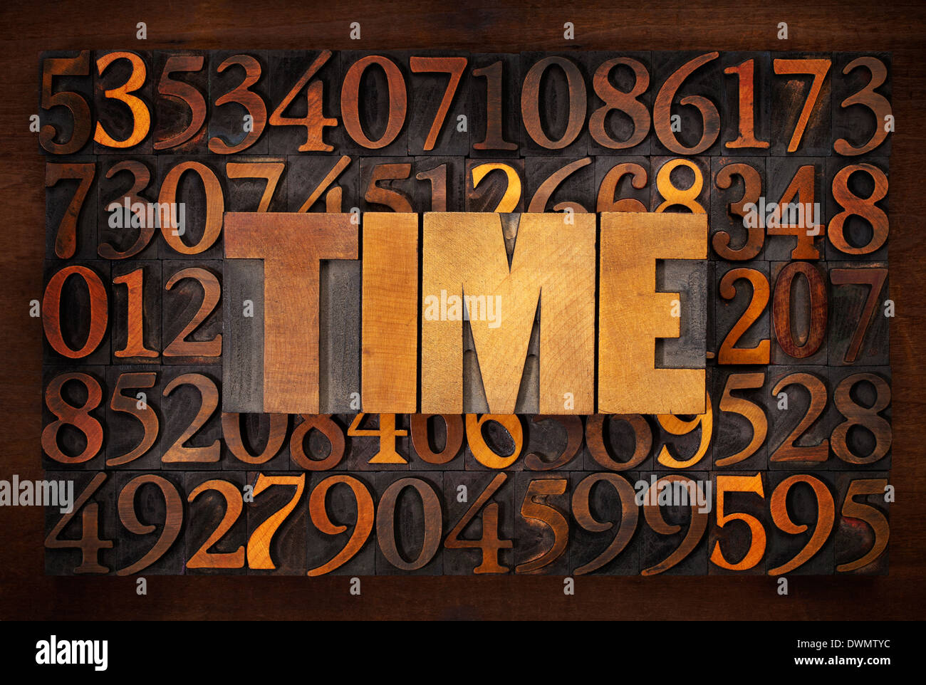 time word in wood type against random number background Stock Photo