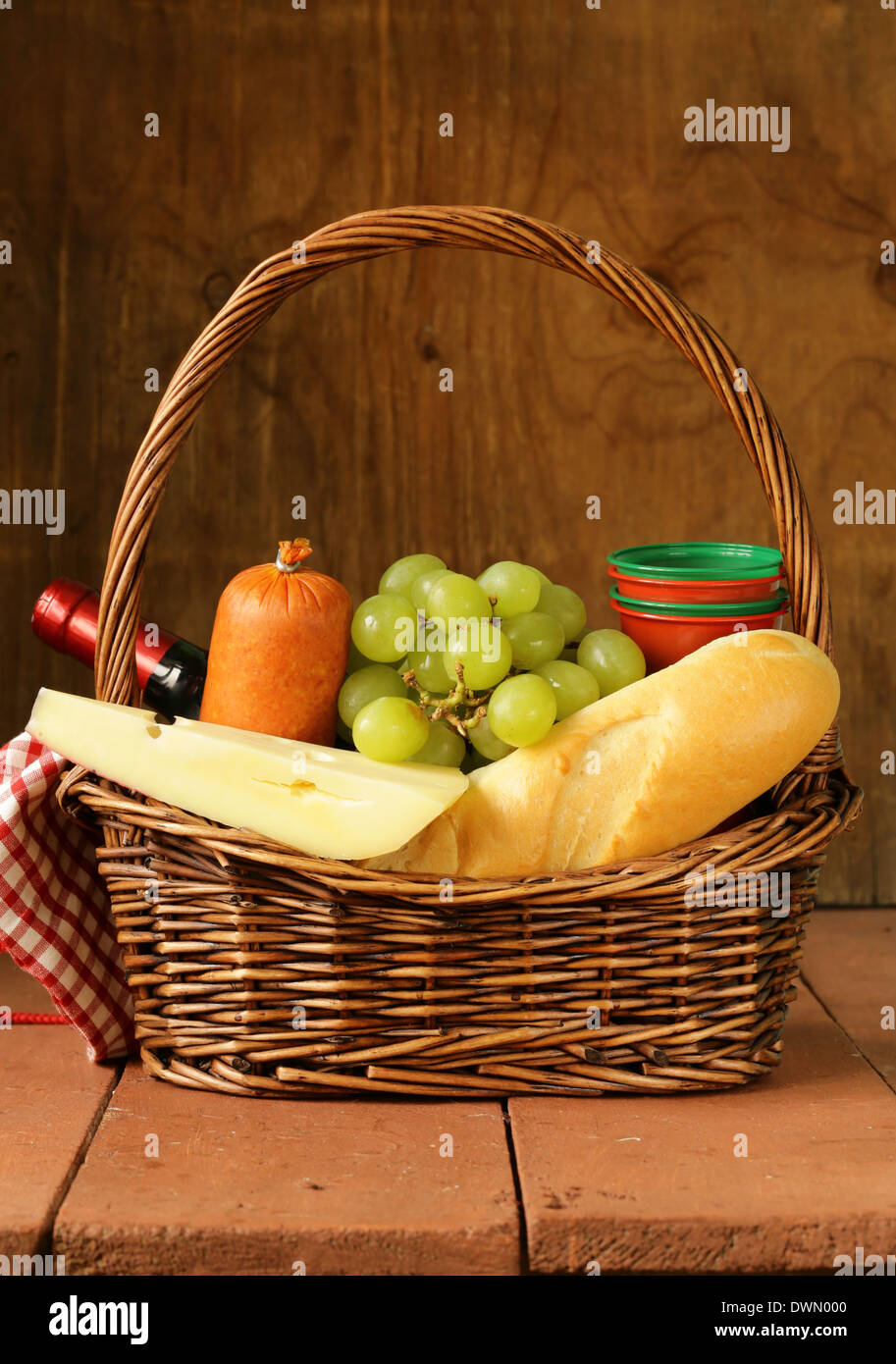 picnic basket wine, fruit, cheese and sausage Stock Photo Alamy