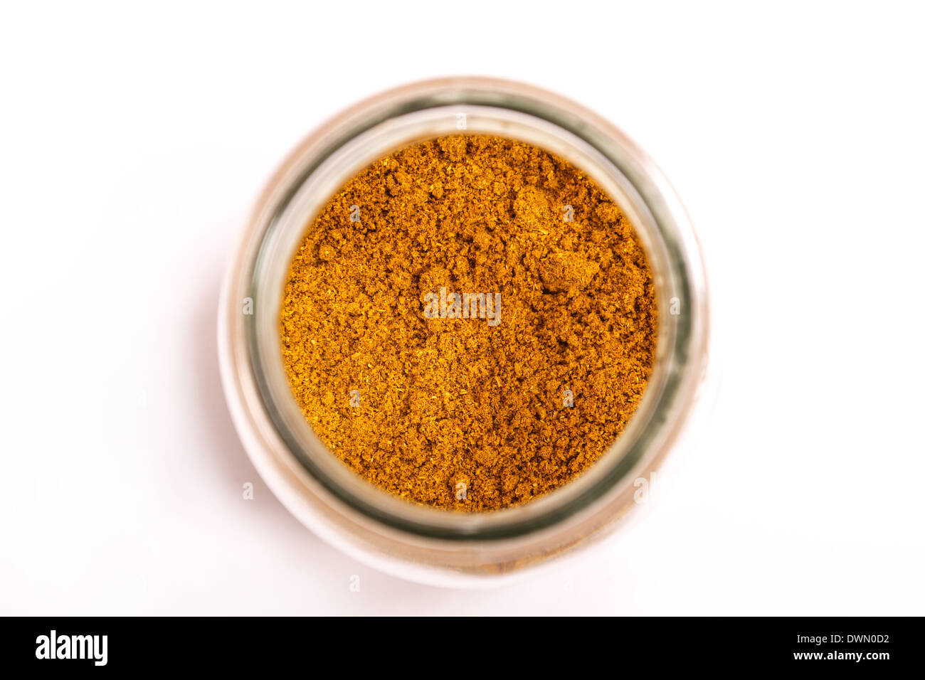Curry powder in a glass pot Stock Photo