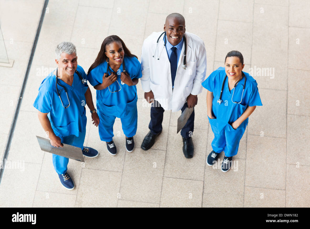 overhead view of group healthcare workers looking up Stock Photo