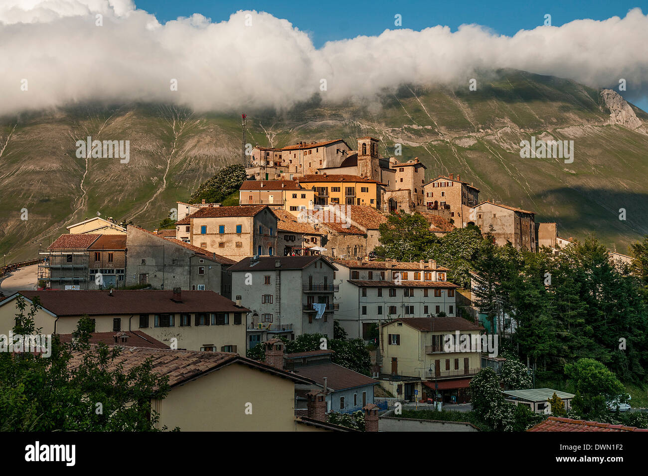 View of Castelluccio di Norcia with clouds on top of mount Vettore ...