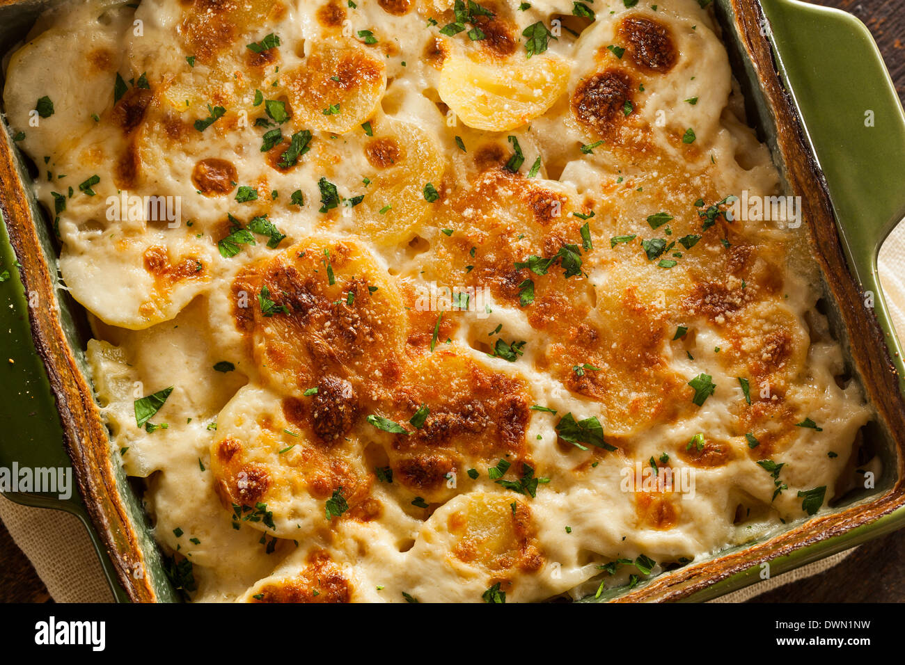 Homemade Cheesey Scalloped Potatoes with Parsley Flakes Stock Photo