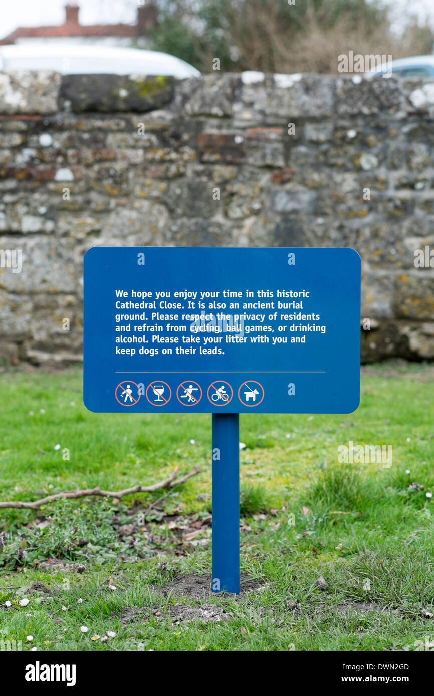Small blue sign advising visitors to Salisbury Cathedral of activity restrictions Stock Photo