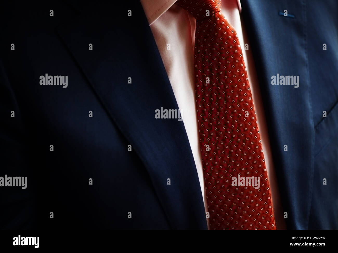 Color shot of a suit and a red tie Stock Photo - Alamy