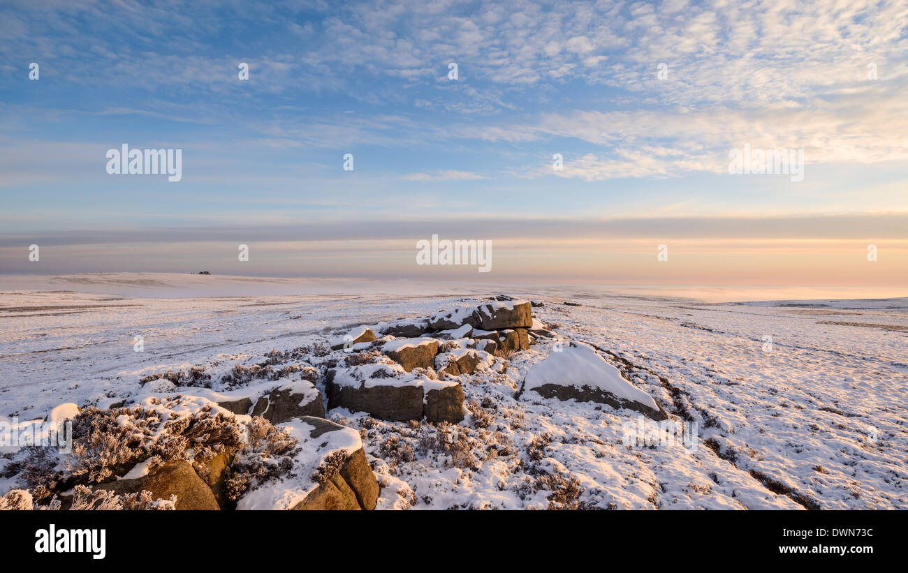 Morning light bathes the boulders and snow covered moor of Pockstones, Washburn Valley, North Yorkshire, Yorkshire, England, UK Stock Photo