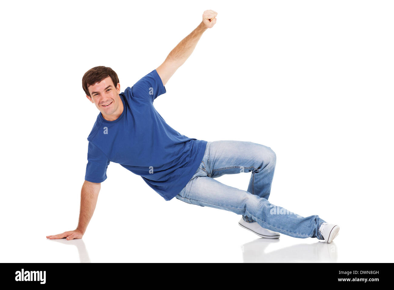 portrait of cheerful man dancing hip-hop in studio Stock Photo
