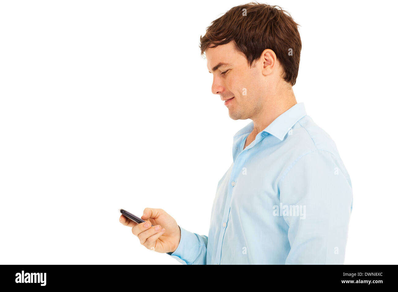 side view of happy man using smart phone on white background Stock Photo