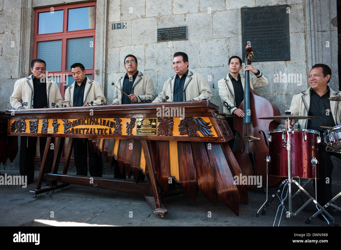 A Marimba band plays outside the historic Casa de la Cultura in Quetzaltenago, Guatemala. Stock Photo