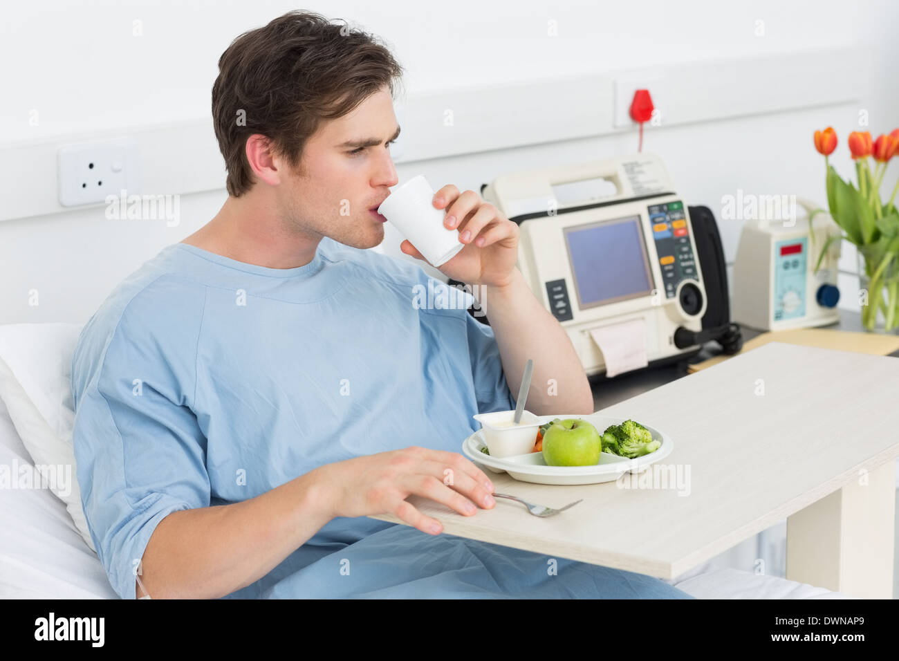 Patient drinking water while having meal Stock Photo Alamy