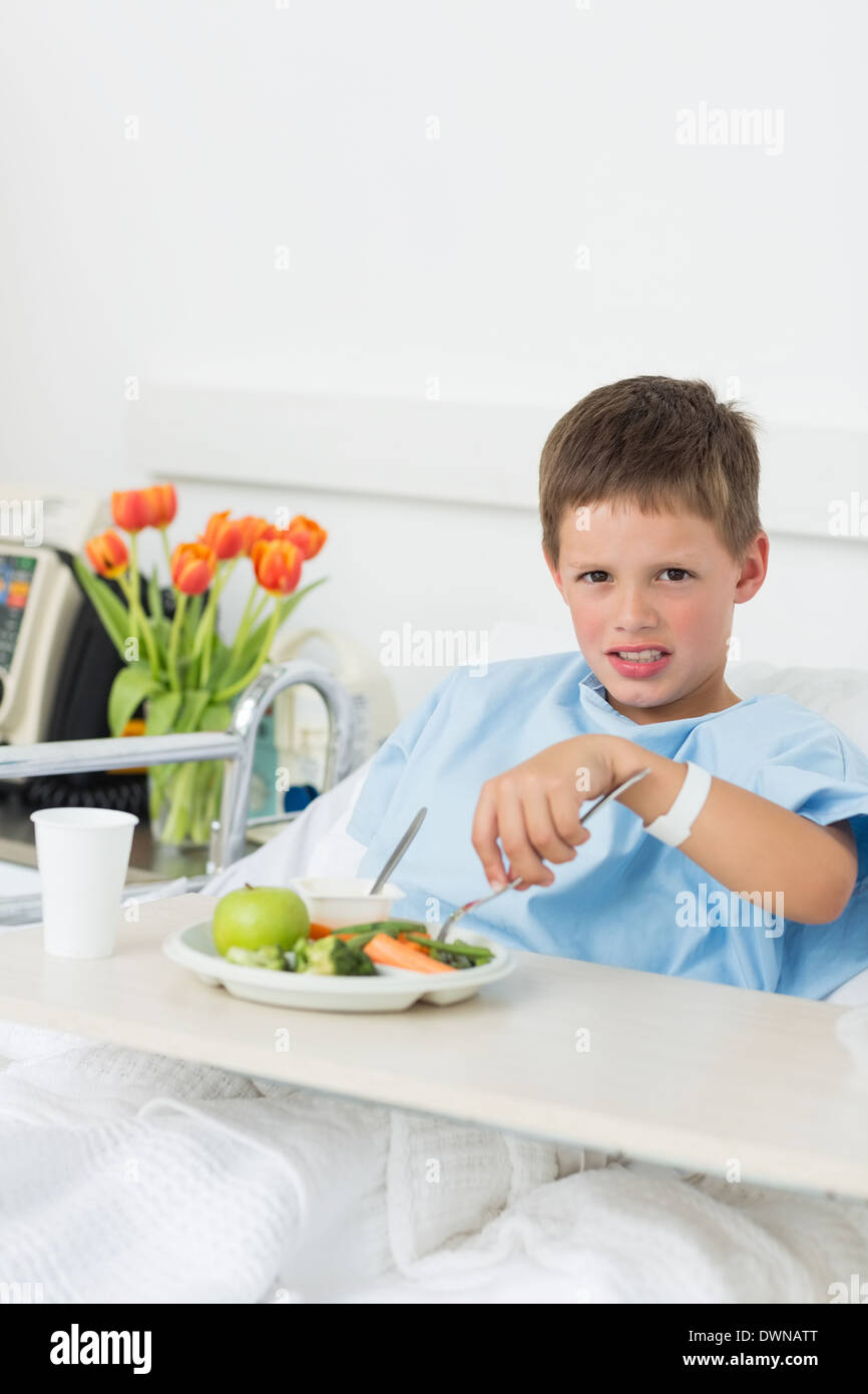Sick Boy Having Food In Hospital Bed Stock Photo - Alamy