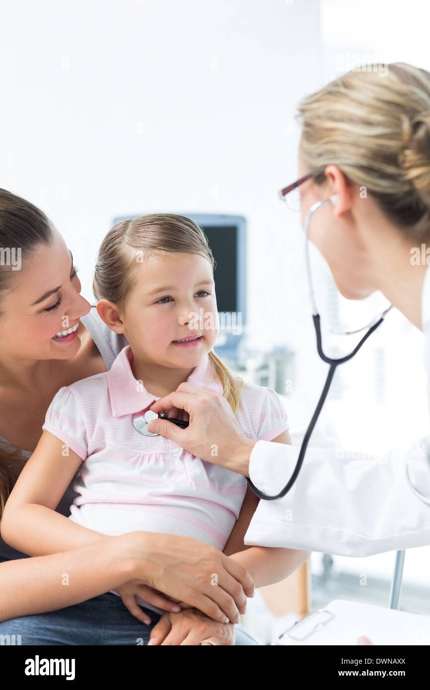 Girl being examined by doctor in hospital Stock Photo