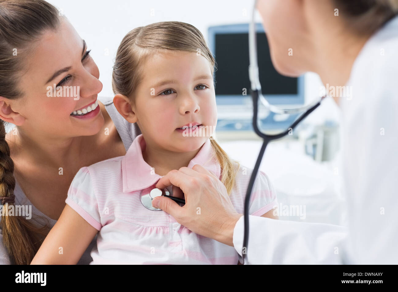 Girl being examined by female doctor Stock Photo