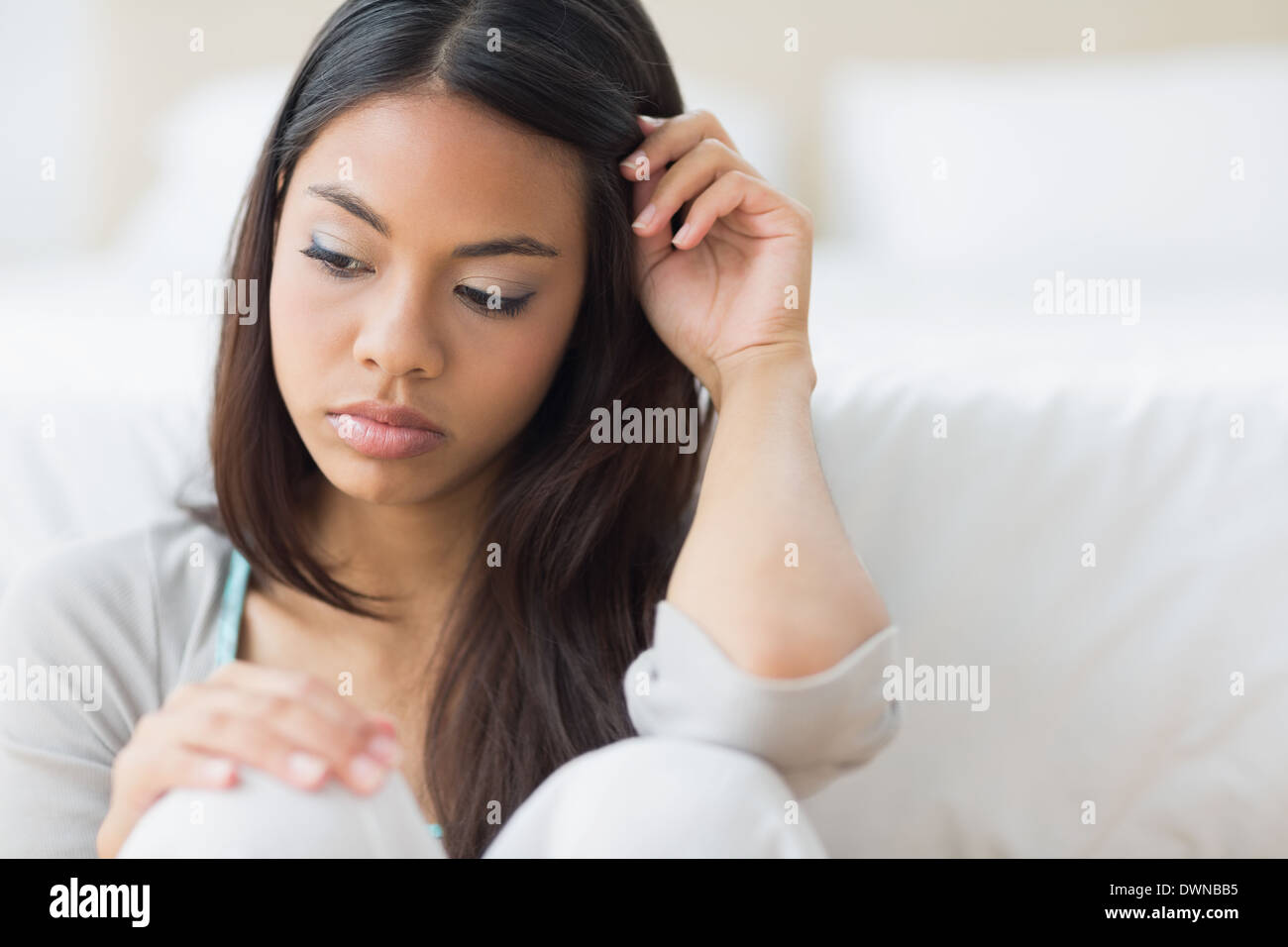Upset girl sitting on the floor Stock Photo Alamy