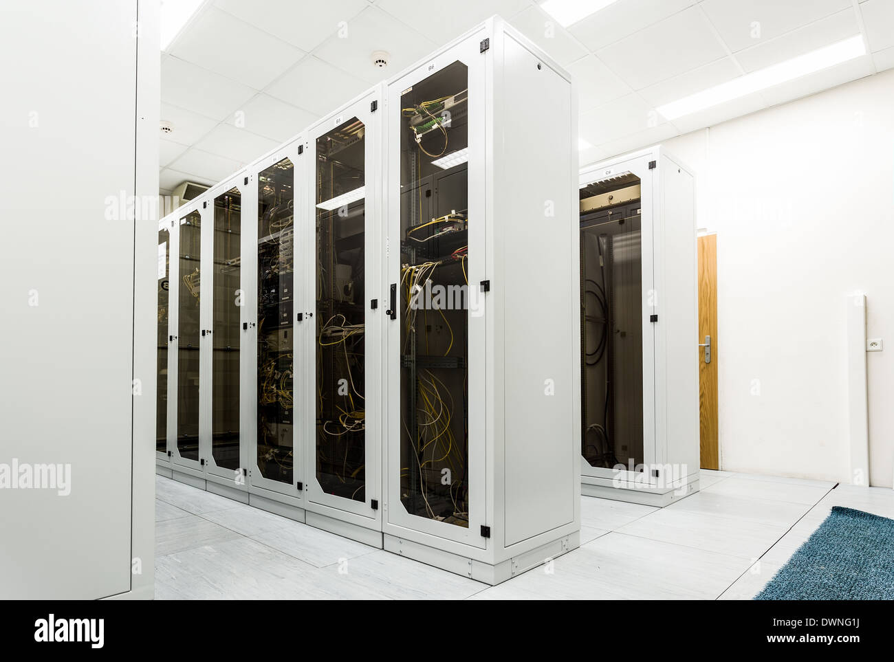 Racks with network equipment in technology telehouse room Stock Photo