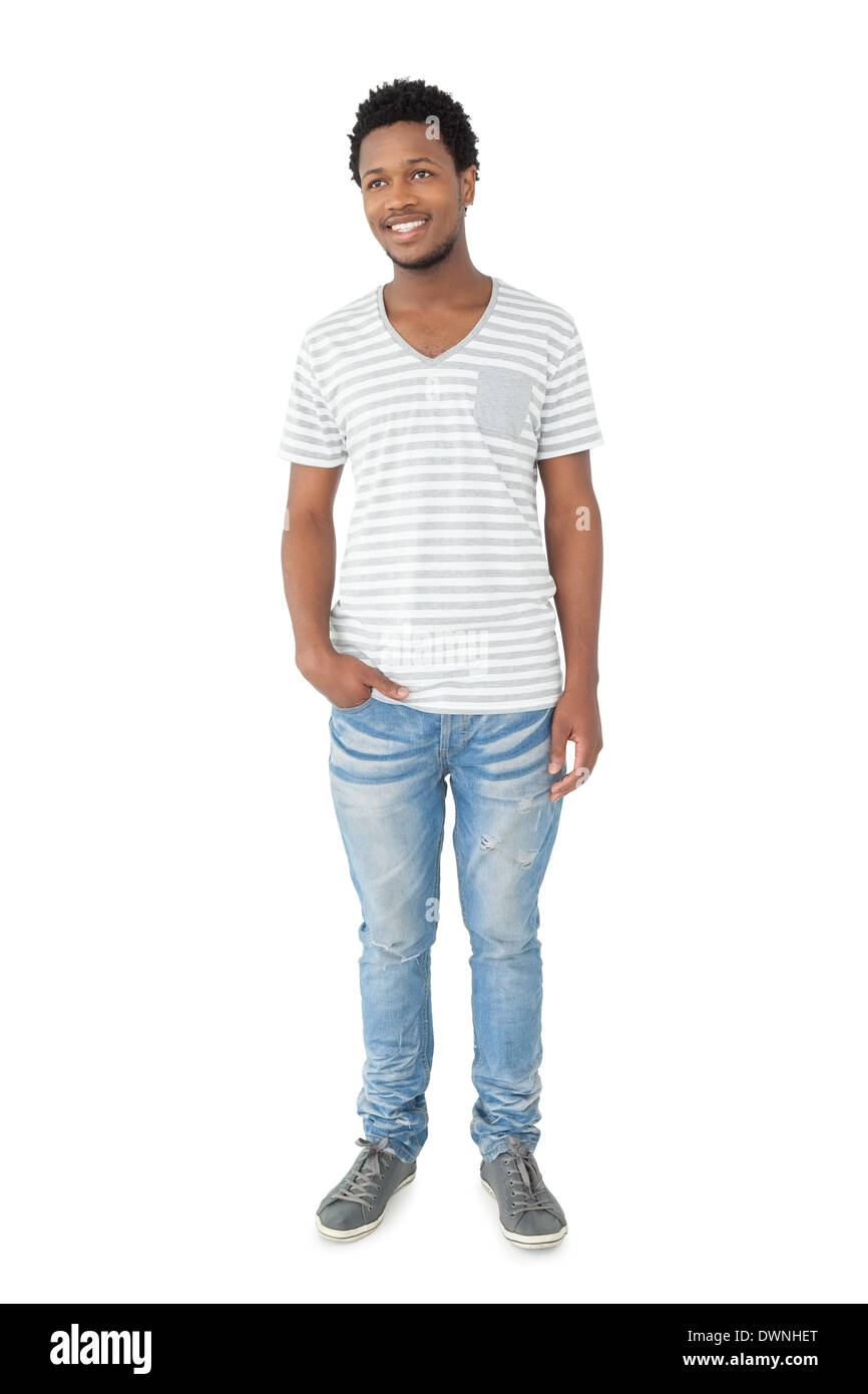 Full length portrait of a smiling young man Stock Photo - Alamy