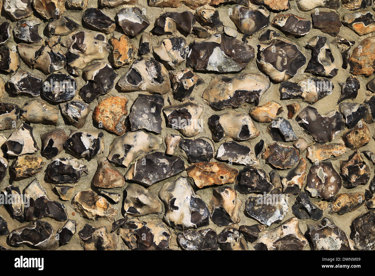 Part of one of the flint walls of the Norman built St Mary's Church, Chilham, Kent Stock Photo
