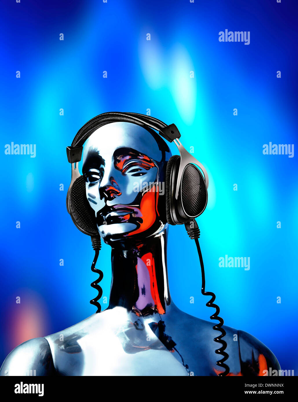 A chrome mannequin wearing headphones Stock Photo