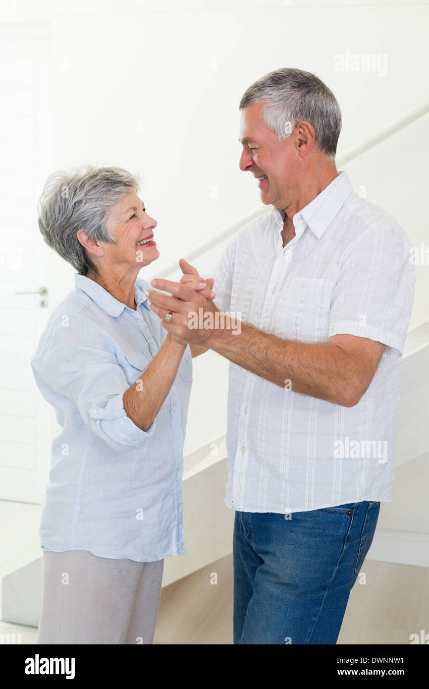 Happy senior couple dancing together Stock Photo