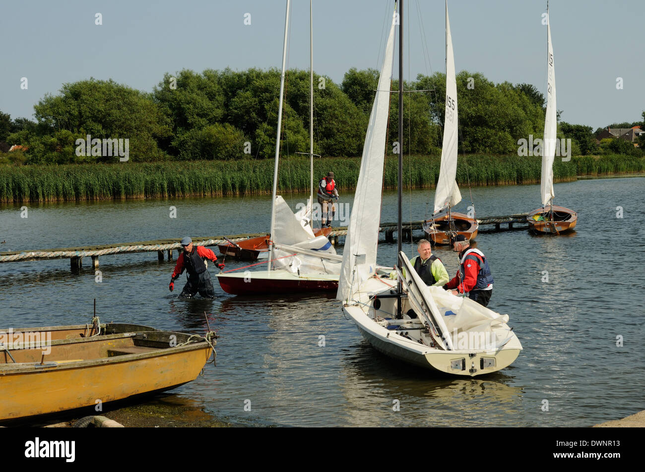 Members of Hornsea Sailing Club in the shallows of Hornea Mere, East