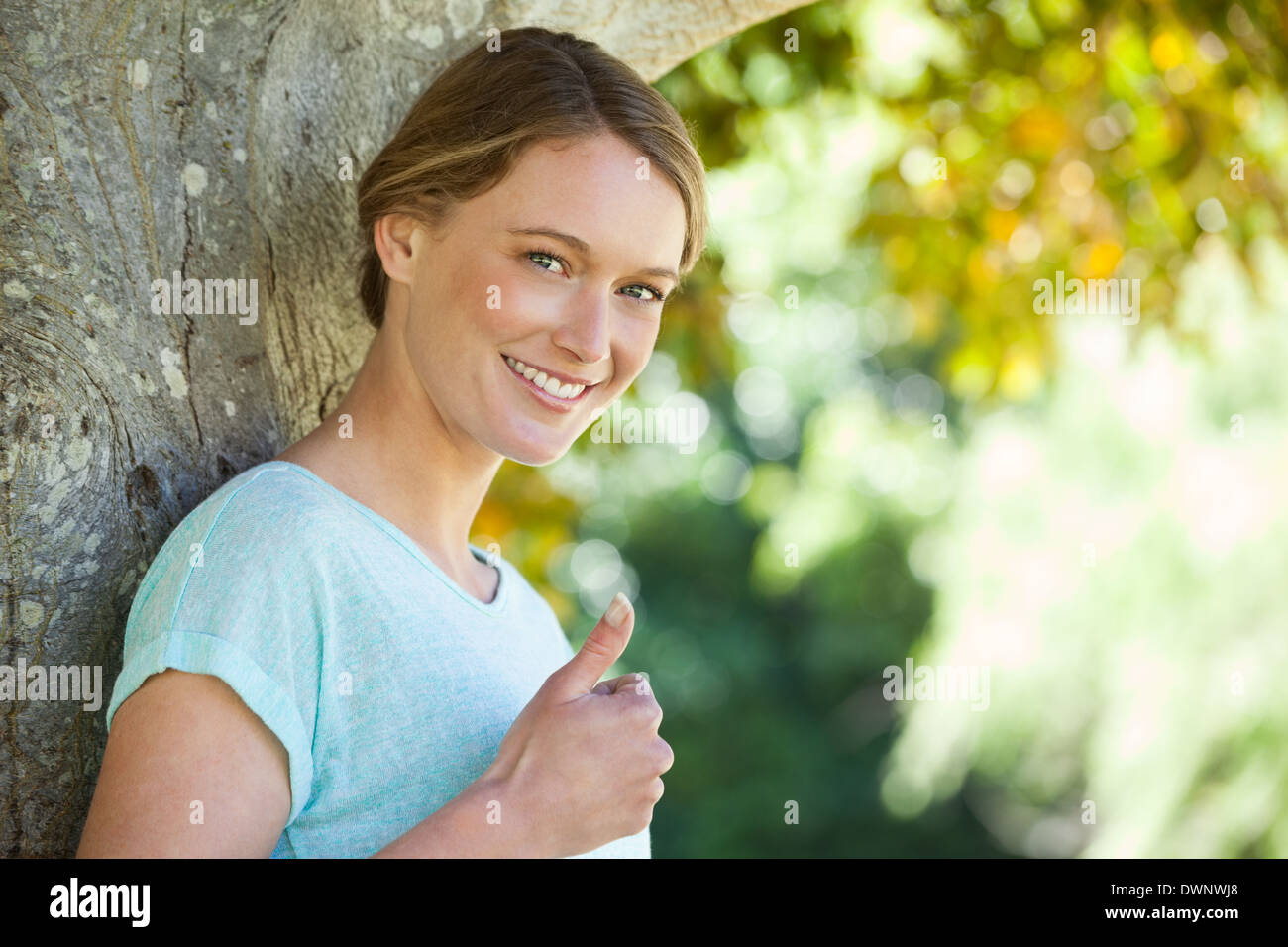 Blonde woman thumbs up outdoors hi-res stock photography and images - Alamy