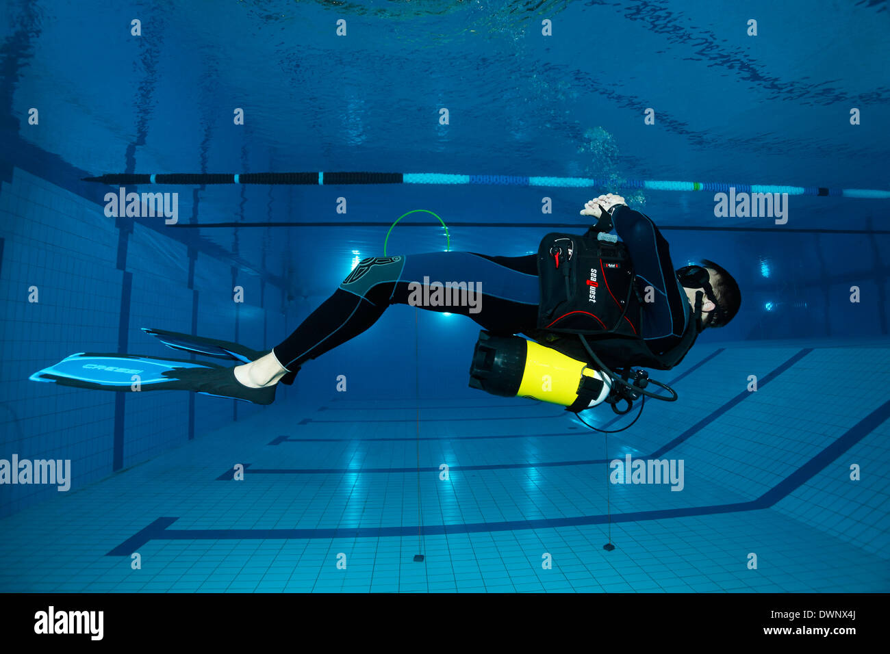 Dive training, scuba diver facing the surface, balancing, in a swimming pool, Nuremberg, Bavaria, Germany Stock Photo