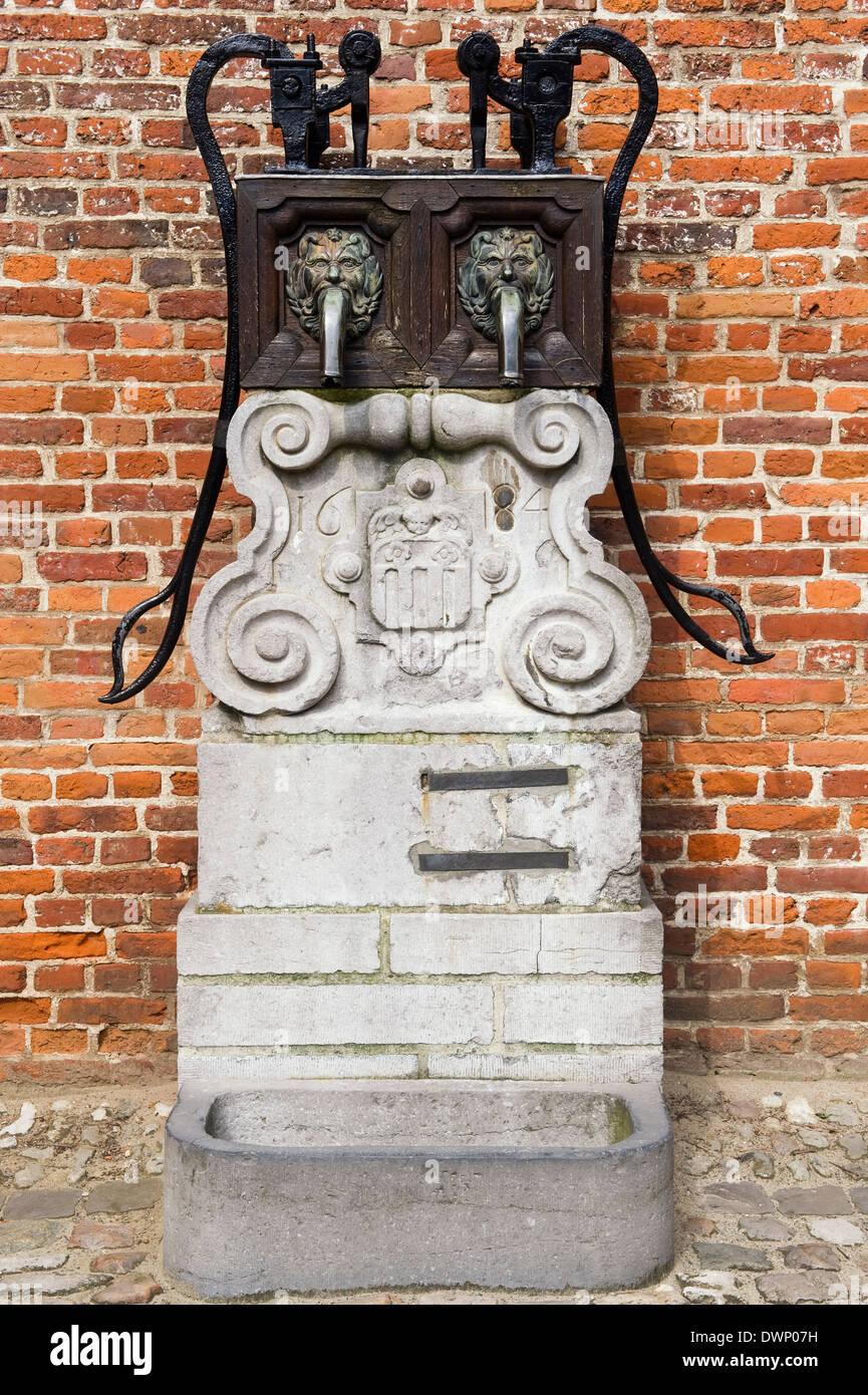 Large beguinage of Leuven, Manual water pump, Belgium, Unesco World Heritage Site Stock Photo