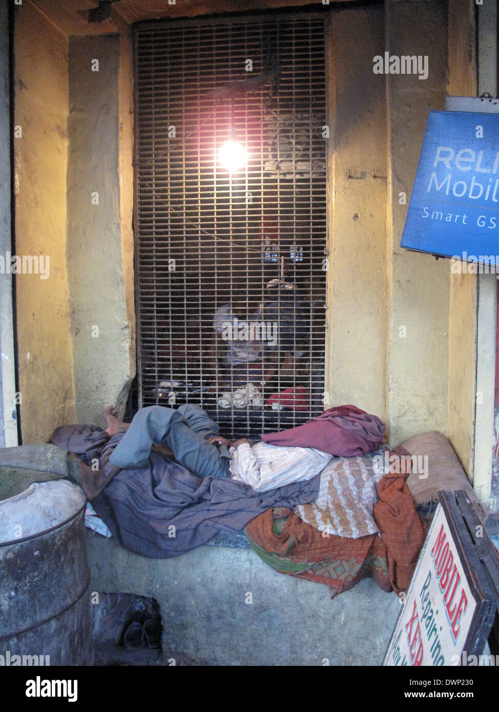 Streets of Kolkata, man sleeping on the streets of Kolkata,India on January 25, 2009. Stock Photo