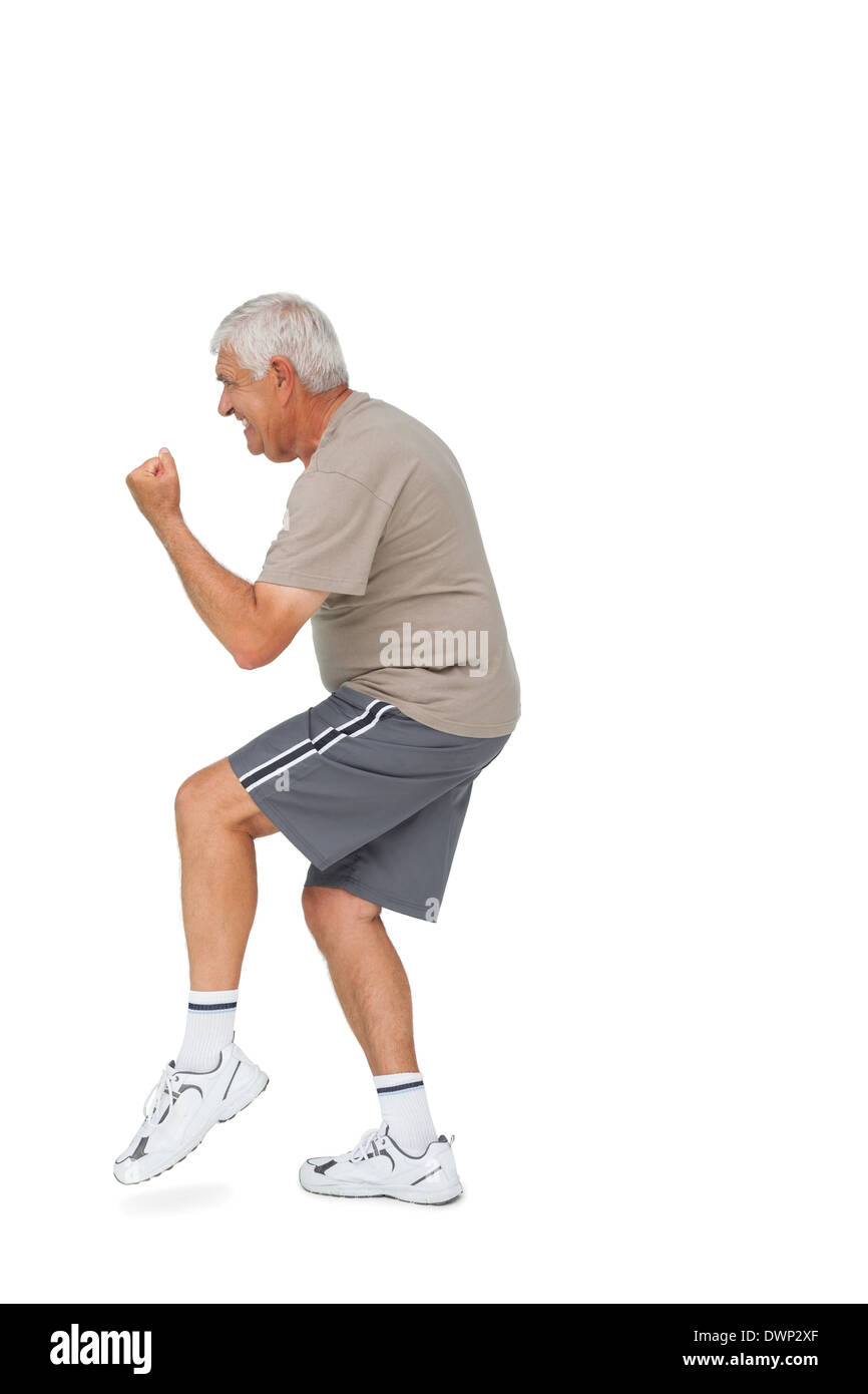Side view of a cheerful senior man with clenched fist Stock Photo Alamy