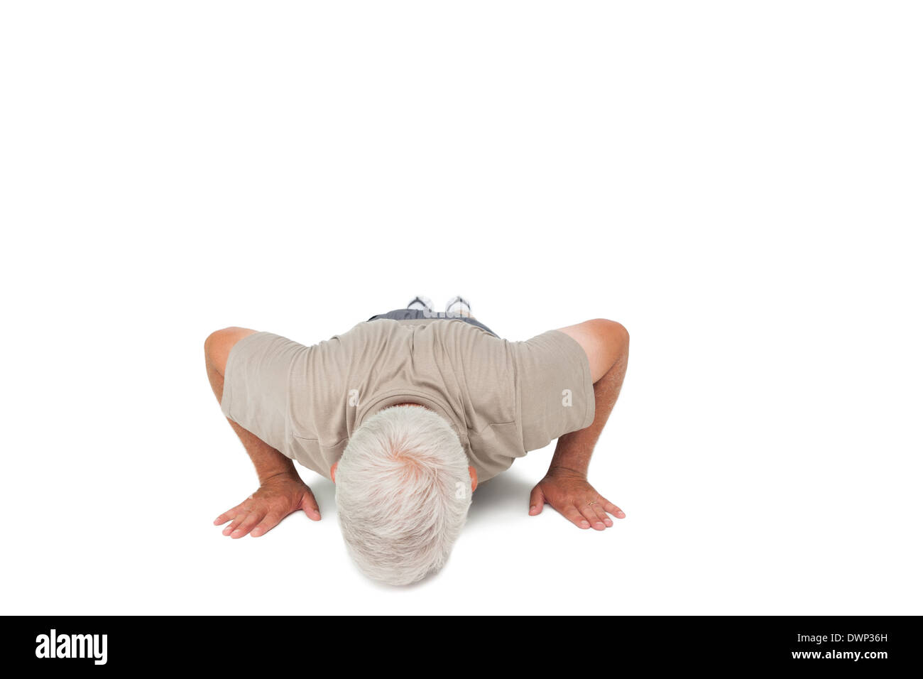Senior man doing push ups Stock Photo