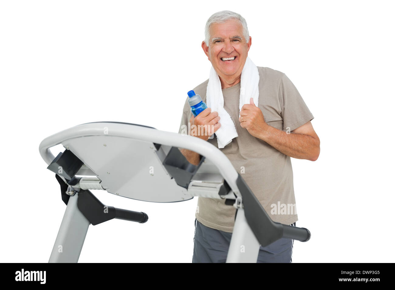 Happy senior man running on a treadmill Stock Photo - Alamy