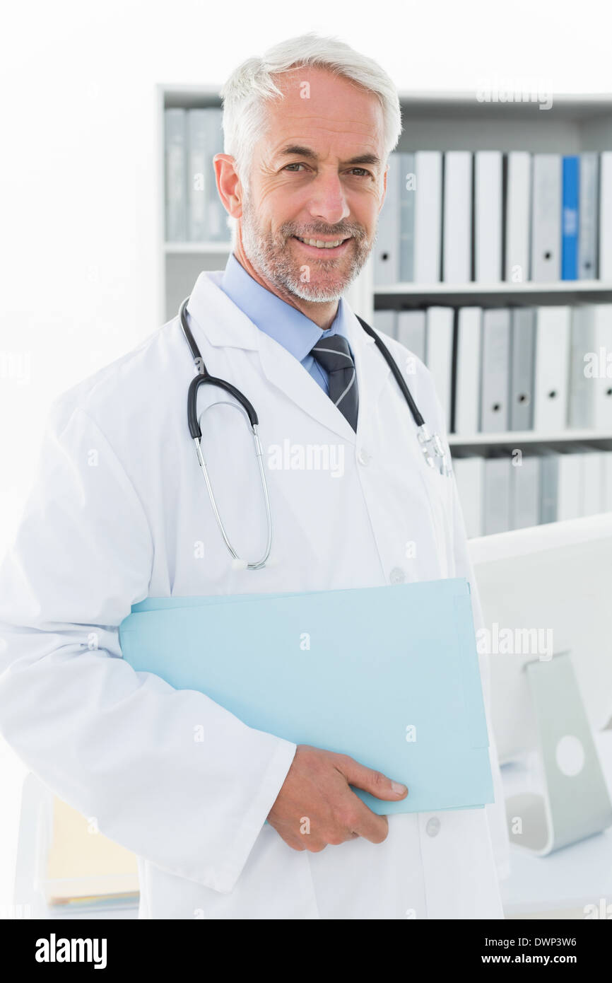 Portrait of a smiling male doctor at medical office Stock Photo - Alamy