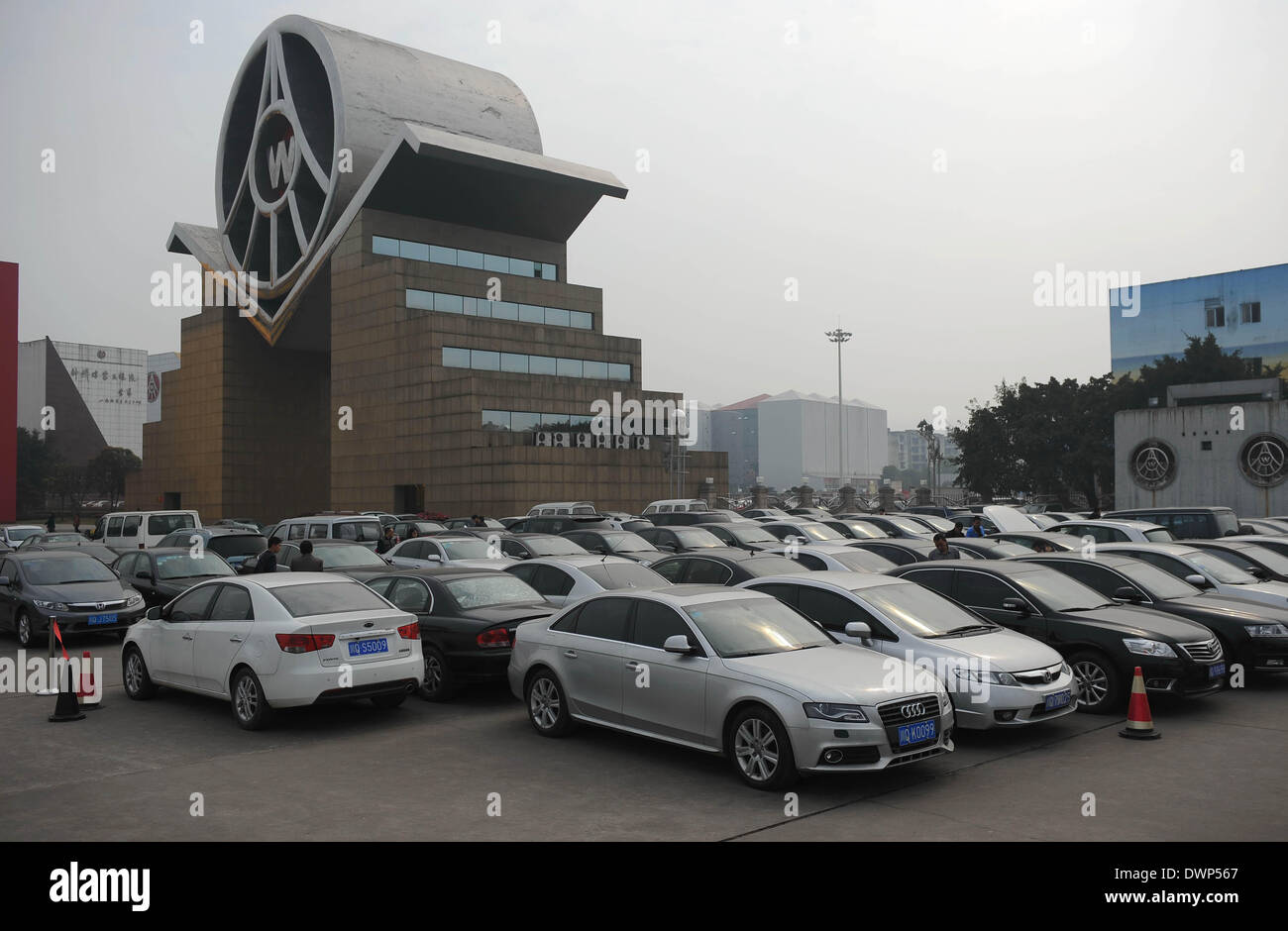 Yibin. 12th Mar, 2014. Photo taken on March 12, 2014 shows the official cars to be auctioned in Yibin City, southwest China's Sichuan Province. The three-day second tour of auction for official cars was held on Wednesday, which will auction 256 official cars belonging to Wuliangye Group as part of the anti-corruption drive to curb official car abuse. © Xue Yubin/Xinhua/Alamy Live News Stock Photo
