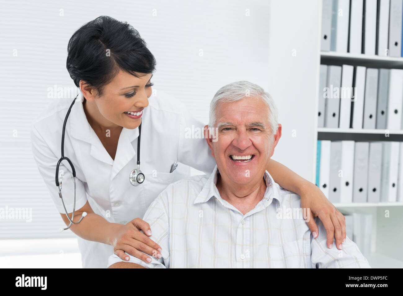 Happy black senior doctor standing hi-res stock photography and images ...