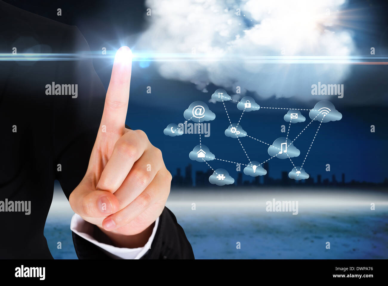 Finger pointing to cloud graphic with app icons Stock Photo