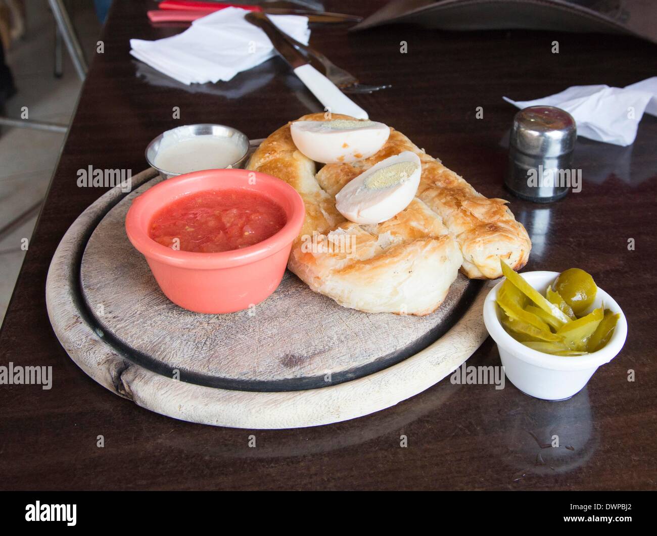 food bar Mama Boreka in Tel Aviv: Boreka with egg and tomatoe sauce, pictured 21.02.2014 Stock Photo