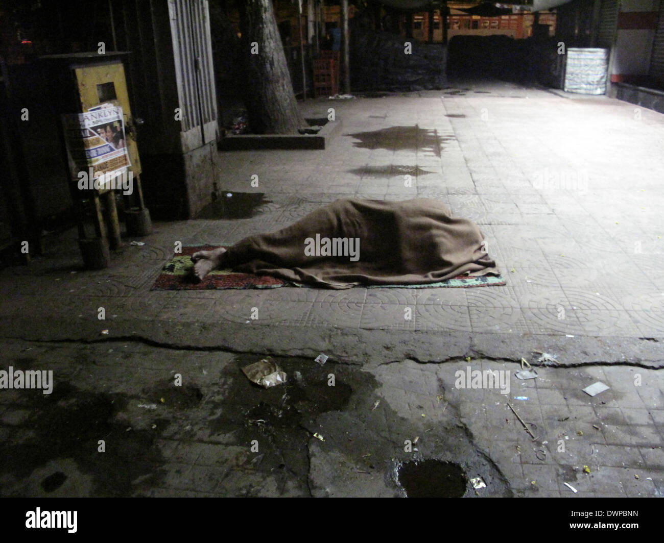 Streets of Kolkata, man sleeping on the streets of Kolkata,India on January 30, 2009. Stock Photo
