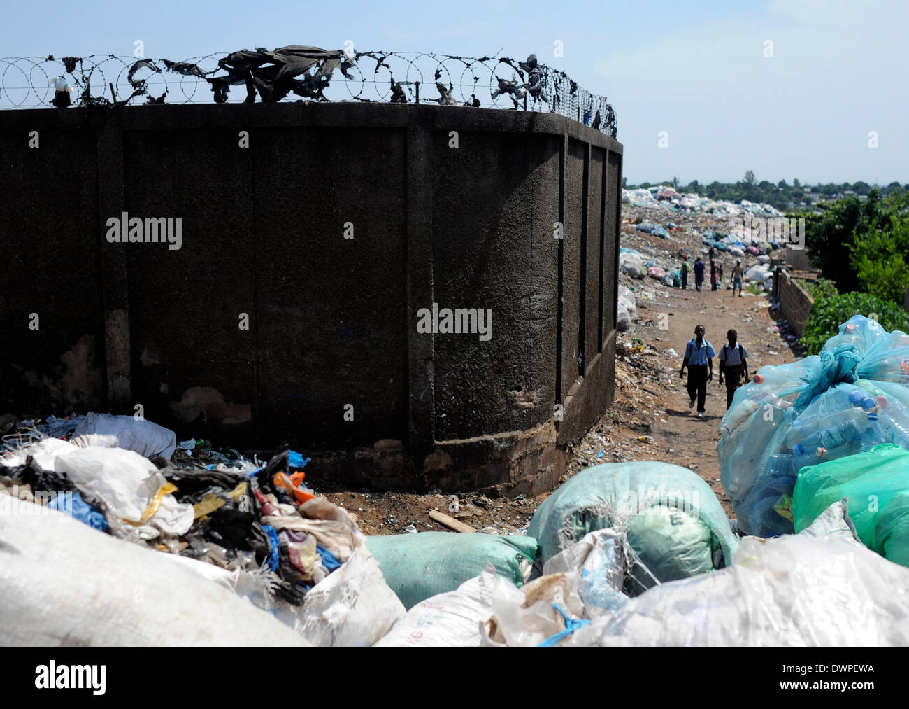 Maputo, Mozambique. 04th Mar, 2013. Garbage bags are stacked up in front of a waste disposal site in Maputo, Mozambique, 04 March 2013. Photo: Britta Pedersen -NO WIRE SERVICE-/dpa/Alamy Live News Stock Photo